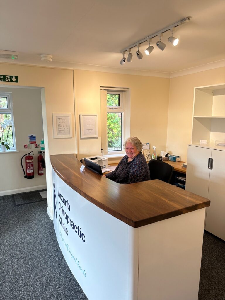 Chiropractor York, Allison at Acomb Chiropractic Clinic reception desk.