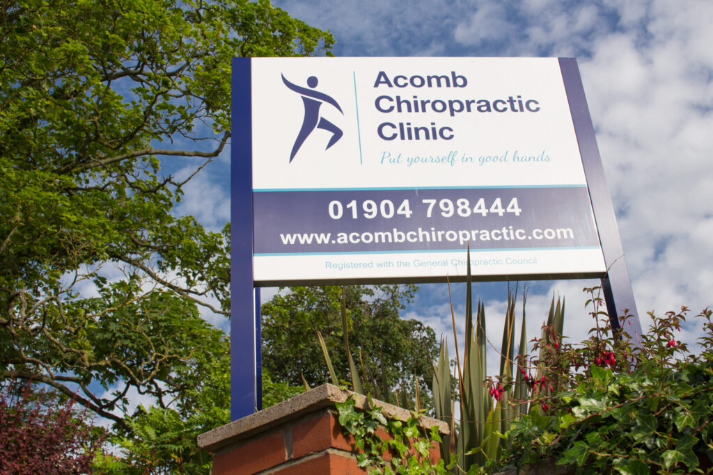 picture of York Chiropractors Acomb Chiropractic Clinic outside sign, with telephone number and web address.